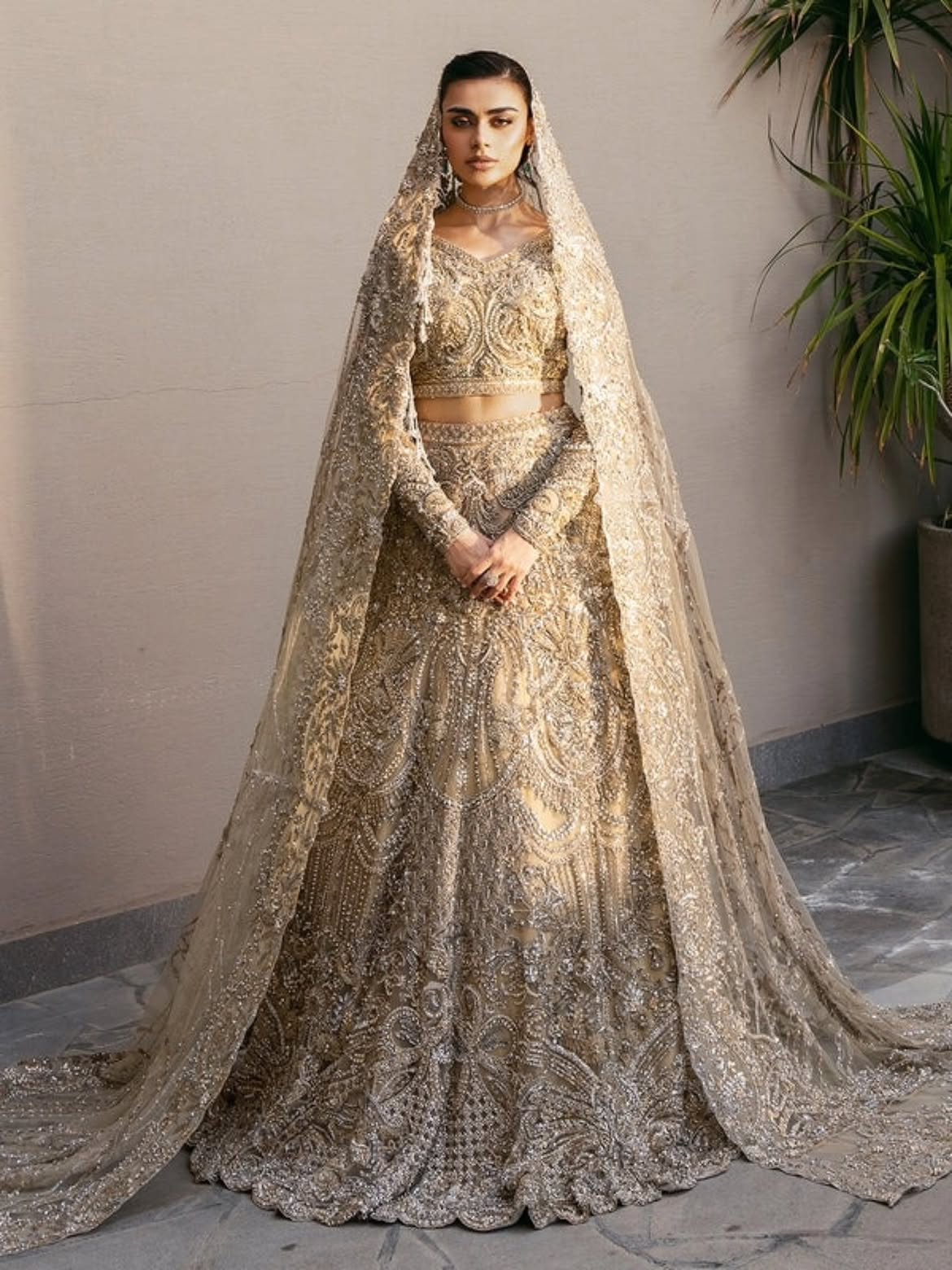 Heavily embellished silver-gold bridal wear