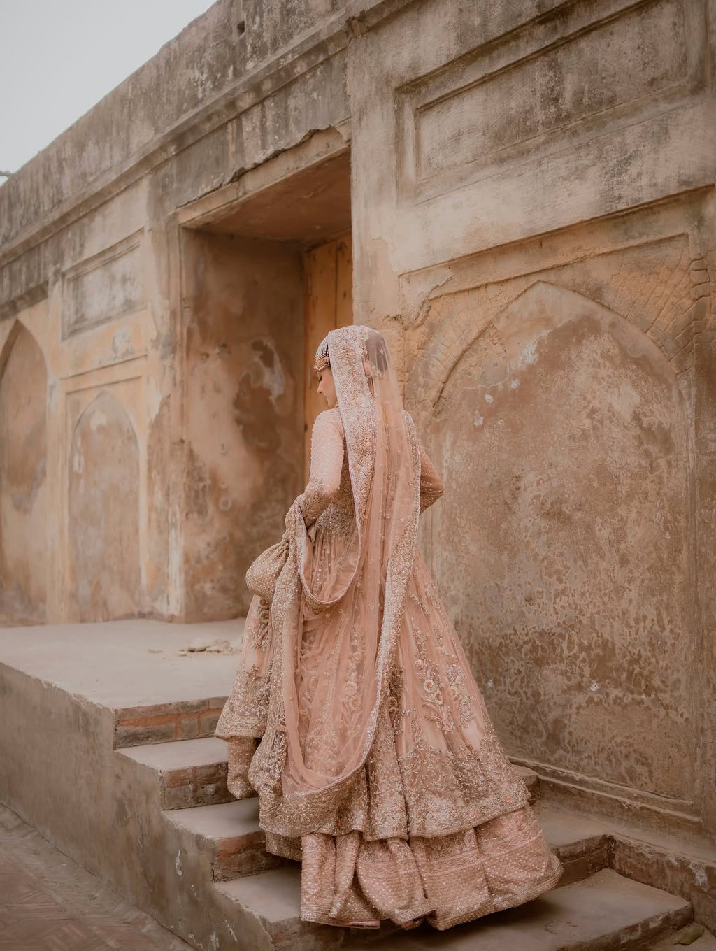 PEACHY VOLUMINOUS FLARED BRIDAL LEHENGA CHOLI