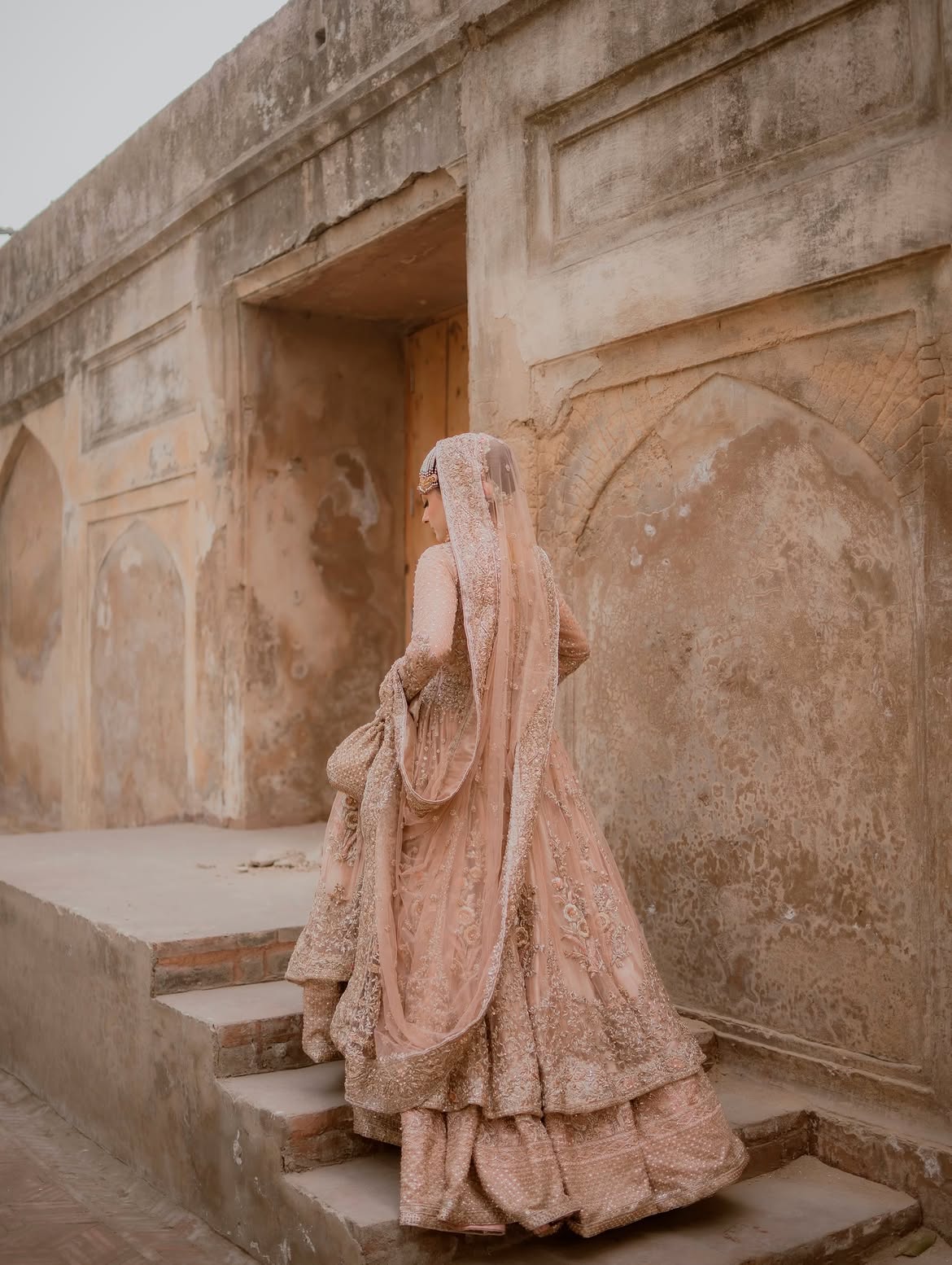 PEACHY VOLUMINOUS FLARED BRIDAL LEHENGA CHOLI
