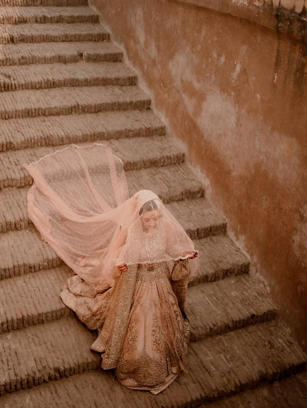 PEACHY VOLUMINOUS FLARED BRIDAL LEHENGA CHOLI